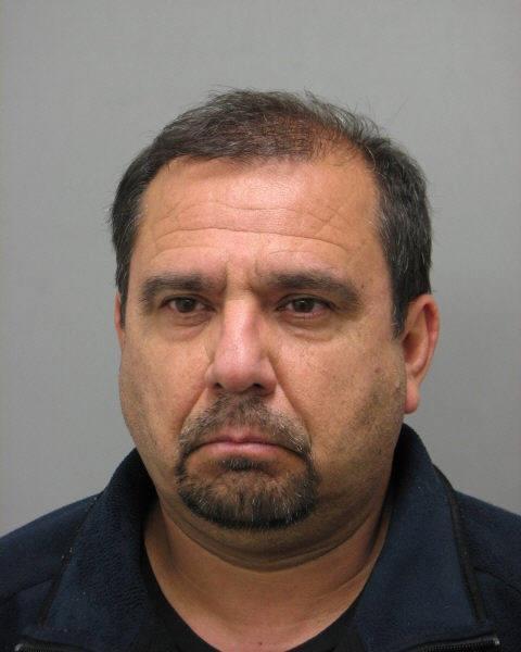 Custodian arrested, charged with shower taping