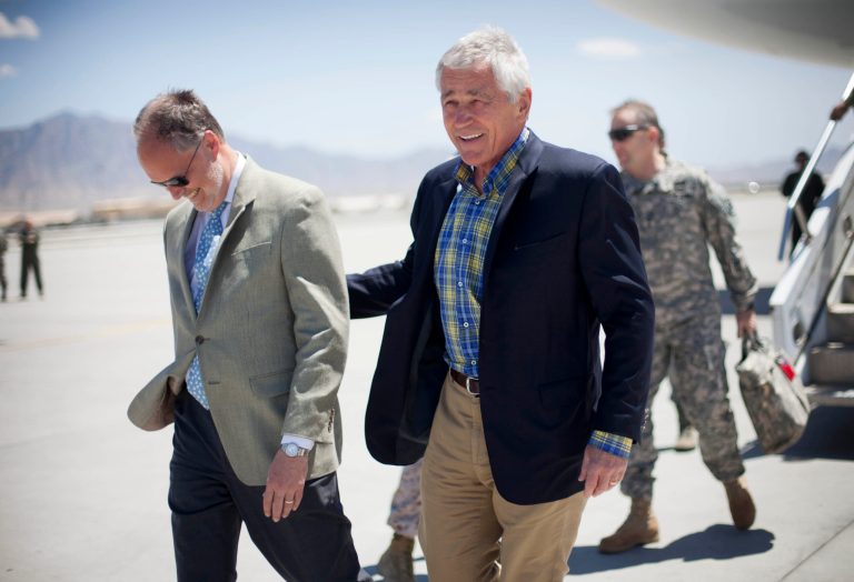 U.S. Defense Secretary Chuck Hagel, right, walks on the tarmac with U.S. Ambassador to Afghanistan James Cunningham, left, during his arrival to Bagram Airfield in Afghanistan, Sunday, June 1, 2014. (AP Photo/Pablo Martinez Monsivais, POOL)