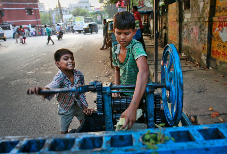 Ravi, 8, left, and Guddu, 12, extract sugarcane juice, in Gauhati, India, Friday, Oct. 10, 2014. Malala Yousafzai of Pakistan and Kailash Satyarthi of India won the Nobel Peace Prize on Friday, Oct. 10, 2014, for risking their lives to fight for childrenâs rights. (AP Photo/Anupam Nath)