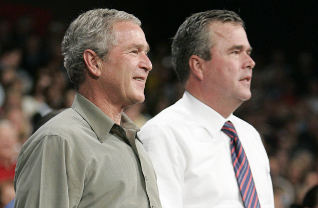 President George W. Bush, left, stands on stage with his brother Florida Gov. Jeb Bush, right, at a campaign rally at Pensacola Civic Center, Monday, Nov. 6, 2006, in Pensacola, Fla. (AP Photo/Pablo Martinez Monsivais)