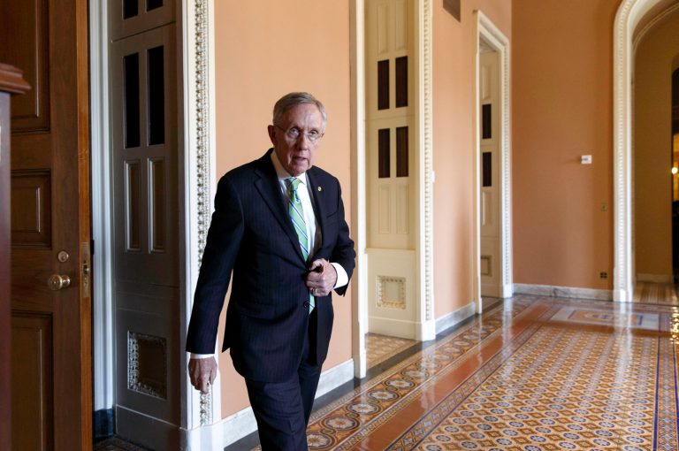 FILE -This June 24, 2014, file photo shows Senate Majority Leader Harry Reid of Nevada on his way to speak to reporters on Capitol Hill in Washington. After changing Senate rules to speed President Barack Obama's nominees through the Senate, Reid has started demanding 60-vote majorities for virtually everything else, most recently to deny Republican leader Mitch McConnell a chance to block rules limiting carbon emissions. (AP Photo/J. Scott Applewhite, File)