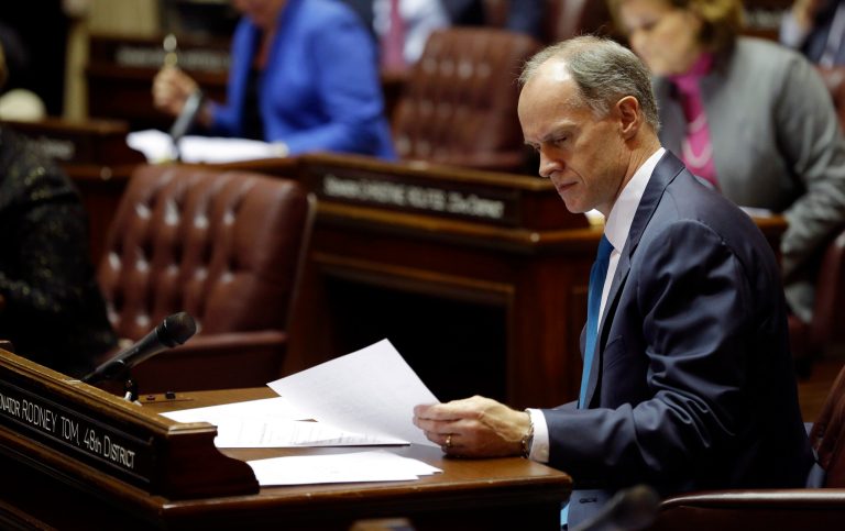 Senate Majority Leader Rodney Tom, D-Medina, looks over a document on the first day of the 2014 session of the Washington state Legislature, Monday, Jan. 13, 2014, at the Capitol in Olympia, Wash. (AP Photo/Ted S. Warren)