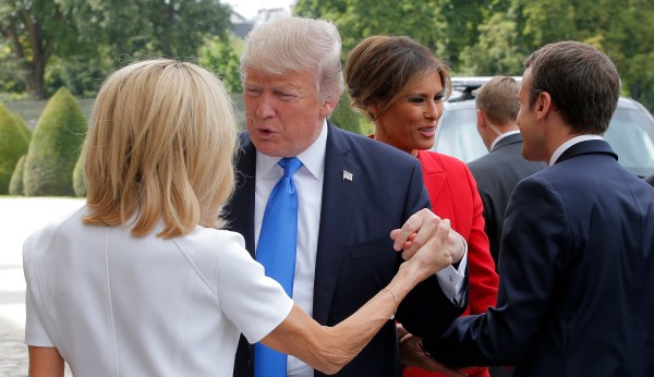 Watch: Trump has yet another awkward handshake with Emmanuel Macron and his wife