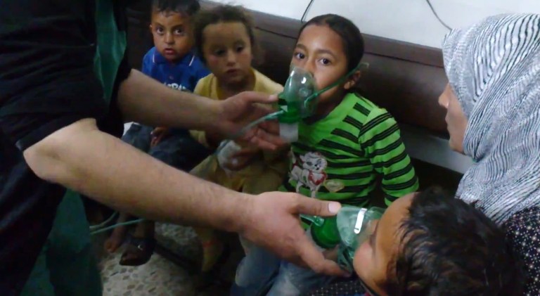 FILE - In this file image taken from video obtained from the Shaam News Network, posted on April 16, 2014, an anti-Bashar Assad activist group, which has been authenticated based on its contents and other AP reporting, children are seen receiving oxygen in Kfar Zeita, a rebel-held village in Hama province some 200 kilometers (125 miles) north of Damascus. A toxic chemical, almost certainly chlorine, was used "systematically and repeatedly" as a weapon in attacks on villages in northern Syria earlier this year, the global chemical weapons watchdog said Wednesday, Sept. 10, 2014.