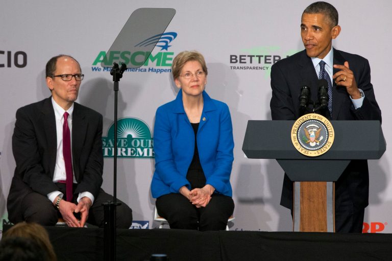 Labor Secretary Tom Perez, left, and Sen. Elizabeth Warren, D-Mass., center, have been pushing forÂ President Barack Obama'sÂ proposed rule to crack down on conflicts of interest in financial advising. (AP Photo/Jacquelyn Martin)
