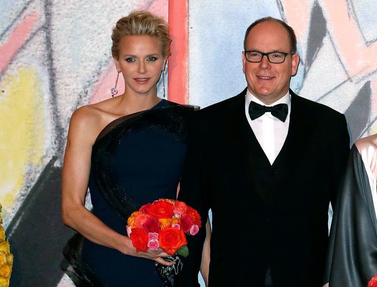 FILE-  In this Saturday, March 29, 2014 file photo, Prince Albert II of Monaco, and his wife Princess Charlene pose for photographers as they arrive at the Rose Ball for the 50th anniversary of the Princess Grace Foundation, in Monaco. Princess Charlene of Monaco, who married Prince Albert II in 2011, has announced she is pregnant with the pair's first baby. The 36-year-old South African former Olympic swimmer and her husband issued a statement expressing their 
