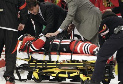 Nam Y. Huh/AP
The Blackhawks'Marian Hossa left on a stretcher after a hit from the Coyotes'Raffi Torres.