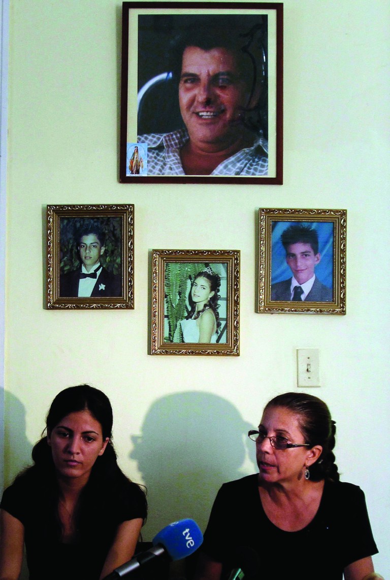 Ofelia Acevedo, right, widow of the late Cuban activist Oswaldo Paya and her daughter Rosa Maria Paya hold a news conference, in Havana, Cuba, Wednesday, Aug 1, 2012. Cuba has charged a Spanish citizen with the equivalent of vehicular manslaughter in the July 22 car accident that killed Acevedo's husband, a prominent dissident and another government opponent. (AP Photo/Franklin Reyes)