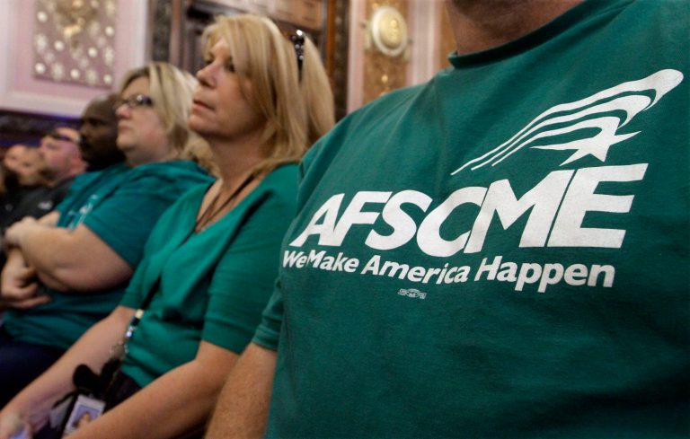 Members of the American Federation of State County and Municipal Employees union.Â (AP Photo/Seth Perlman)