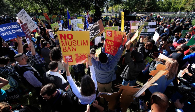 Muslim and civil rights groups and their supporters gather at a rally against what they call a 