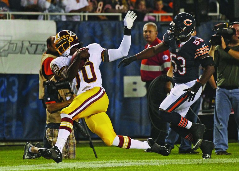 Rex Arbogast/AP
Washington Redskins quarterback Robert Griffin III will face top pick Andrew Luck and the Indianapolis Colts on Saturday.