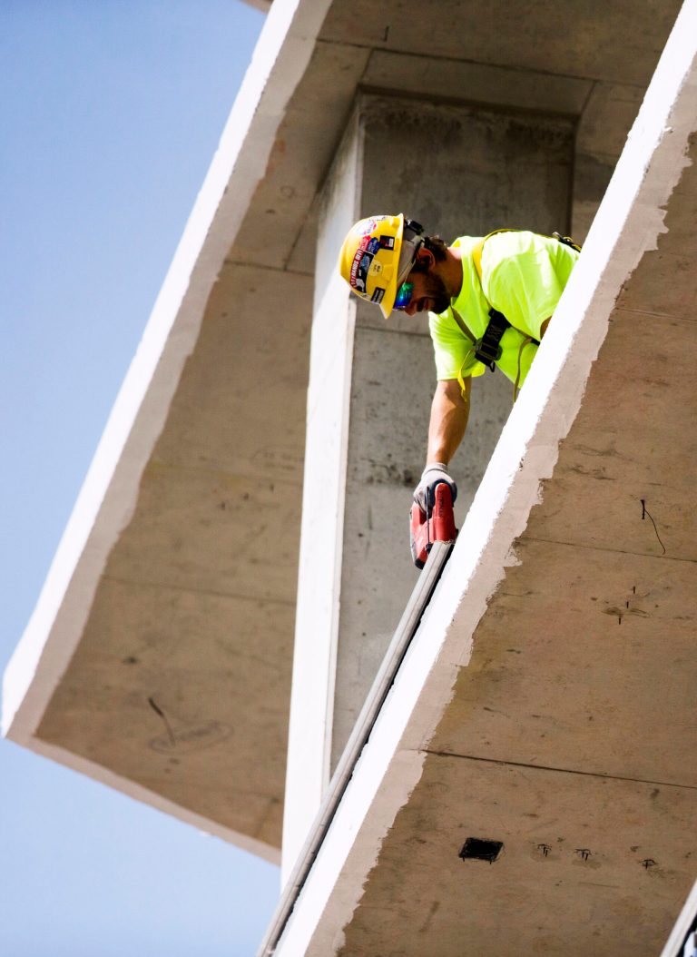 In this July 3, 2014 photo, a construction worker builds housing for students near Drexel University in Philadelphia.  The Commerce Department reports on U.S. construction spending in June on Friday, Aug. 1, 2014. (AP Photo/Matt Rourke)