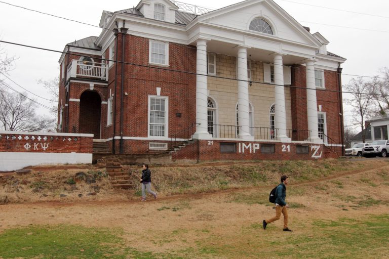 Students walk past the Phi Kappa Psi fraternity house, the center of the discredited Rolling Stone story, on the University of Virginia campus on December 6, 2014 in Charlottesville, Va. (Getty Image)