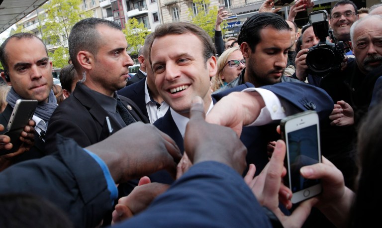 The commission warned people could face criminal charges if they share the information before Sunday's vote. (AP Photo/Christophe Ena)