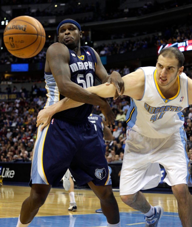   Memphis Grizzlies Zach Randolf (50) tangles with Denver Nuggets Kosta Koufos in the second quarter of a NBA game in Denver on Friday, Dec. 14, 2012.(AP Photo/Joe Mahoney)  