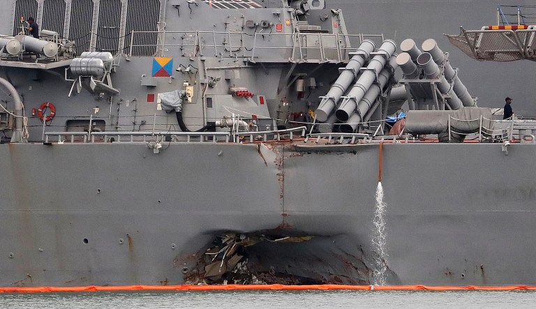 Navy and Marine Corps divers have recovered the remains of a second sailor who was missing from the USS John S. McCain, the Navy said Friday. (AP Photo/Wong Maye-E)