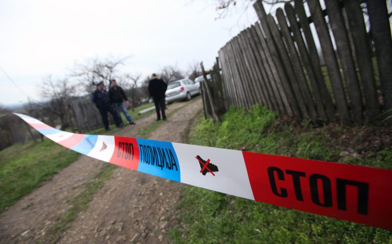 Serbian police officers guard houses in the village of Velika Ivanca, Serbia, Tuesday, April 9, 2013. A 60-year-old man gunned down 13 people, including a baby, in a house-to-house rampage in the quiet village on Tuesday before trying to kill himself and his wife, police and hospital officials said. Belgrade emergency hospital spokeswoman Nada Macura said the man, identified only as Ljubisa B., used a handgun in the shooting spree at five houses. The dead included six women. (AP Photo/Darko Vojinovic)