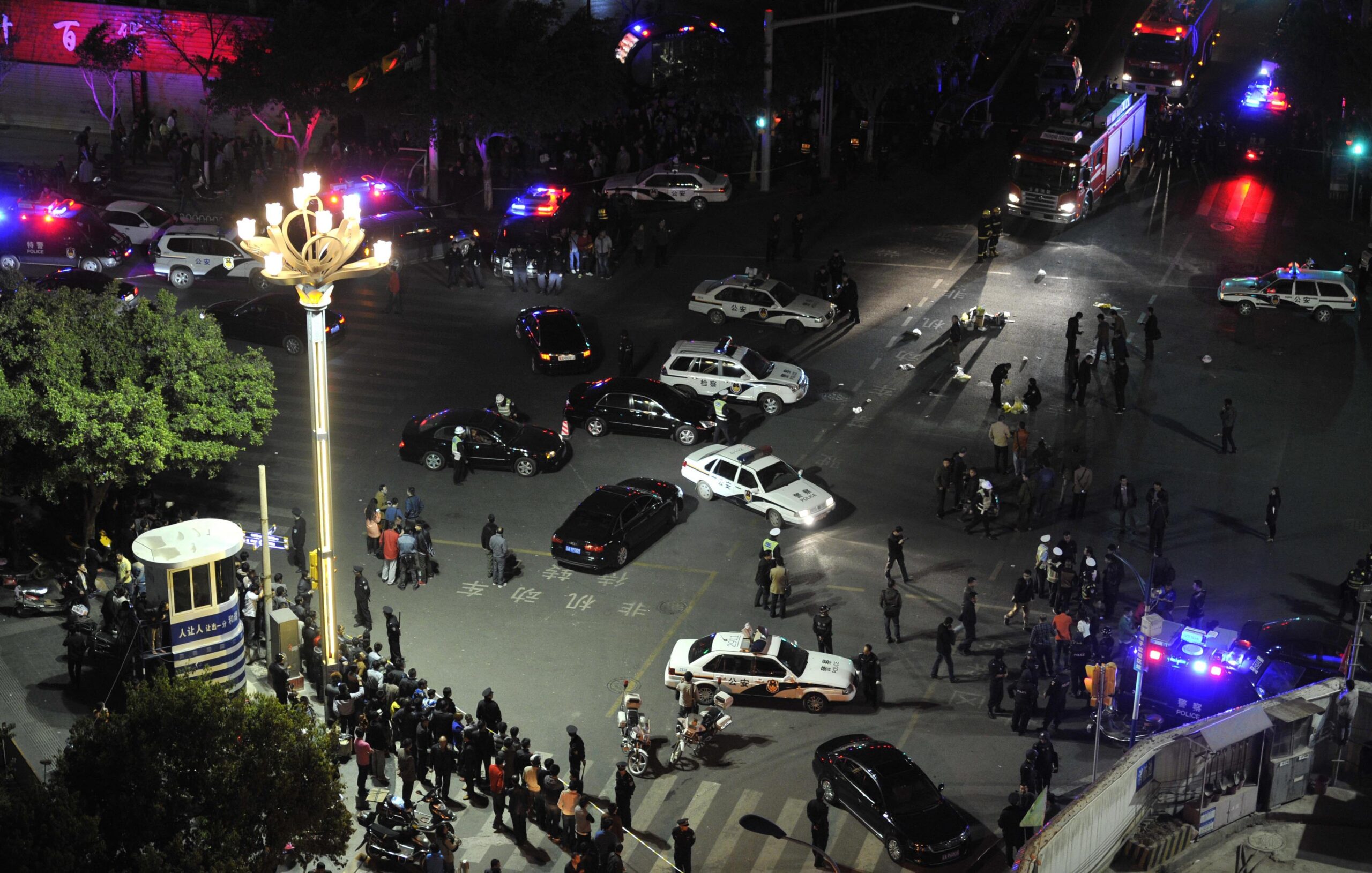 China puts 4 on trial for train station attack