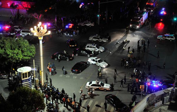 China puts 4 on trial for train station attack