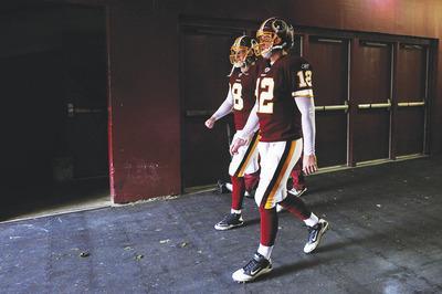 Patrick McDermott/Getty Images
Quarterbacks Rex Grossman, left, and John Beck combined to throw 24 interceptions to just 18 touchdowns this season.