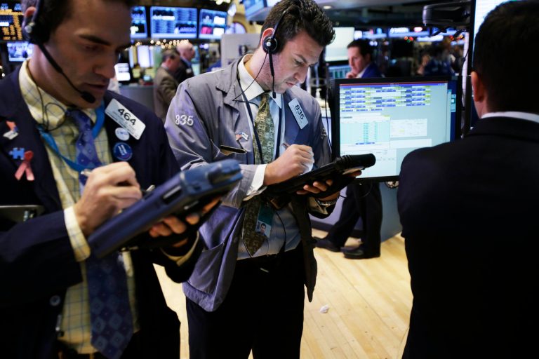   Traders work on the floor at the New York Stock Exchange in New York, Friday, Dec. 28, 2012. Stocks were heading lower Friday, for a fifth day, on concern that Washington lawmakers will fail to reach a budget deal before a year-end deadline. (AP Photo/Seth Wenig)  