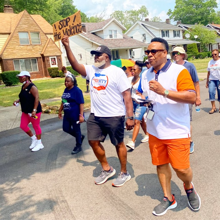 Youngstown Mayor Tito Brown and Police Chief Carl Davis march down Redondo Ave. to encourage peace in the north side neighborhood.