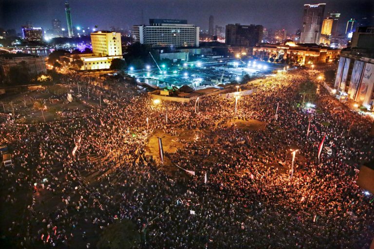 In this Sunday, June 8, 2014 photo, Supporters of Egyptian President Abdel-Fattah el-Sissi celebrate his inauguration in Tahrir Square, Cairo, Egypt. Egyptian police on Monday arrested seven men for sexually assaulting a 19-year-old student during celebrations marking the inauguration of the country's new president in Cairo's central Tahrir Square the day before, security officials said. Sexual harassment has been one of Egypt enduring social ills, prompting authorities last week to issue a decree declaring it a crime punishable by up to five years in prison. Video footage posted on social media shows the student completely naked, parts of her body bloodied as policemen struggle to escort her out of Tahrir Square. (AP Photo/Thomas Hartwell)
