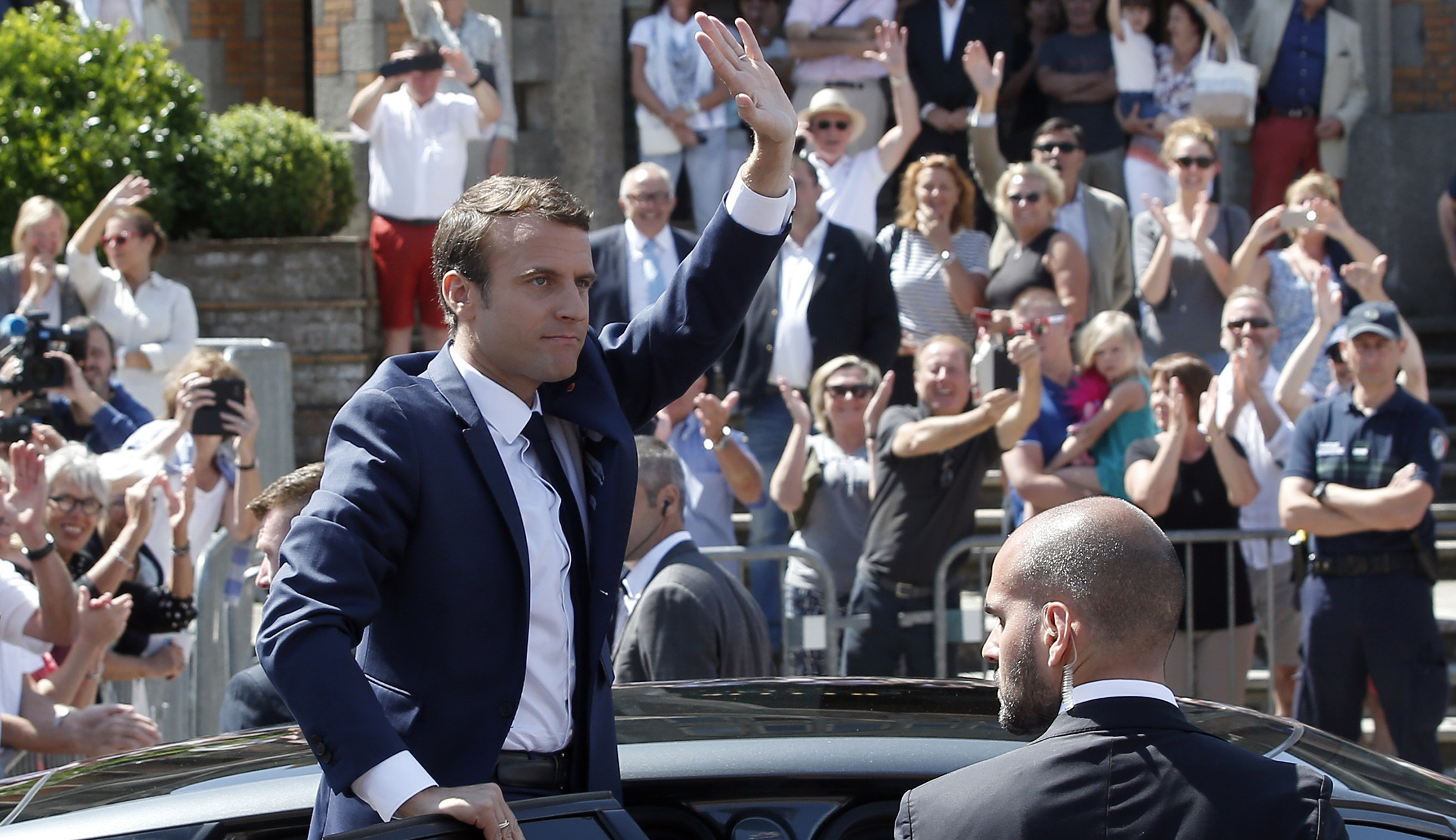 Pollsters project Macron on course to dominate French parliament