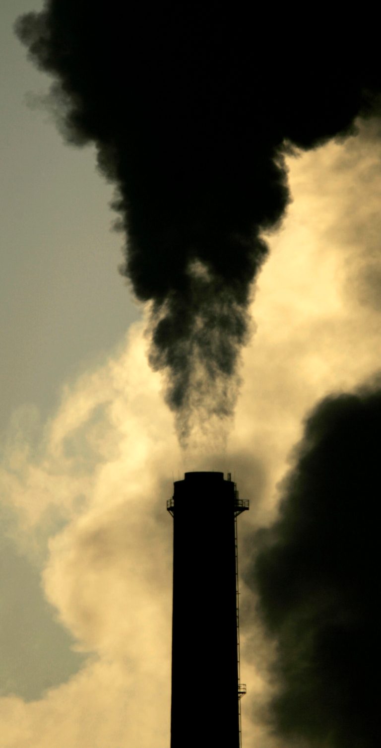 FILE - In this Feb. 2, 2007 file photo vapors  spew from the smokestack at Sunflower Electric Cooperative's coal-fired power plant in Holcomb, Kan. The U.S. Environmental Protection Agency's administrator announced the new regulations for decreasing greenhouse gas emissions Monday, June 2, 2014, in Washington. According to the EPA, Kansas' goal would be to cut emissions 23 percent by 2030. (AP Photo/Charlie Riedel, File)