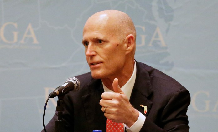 Florida Gov. Rick Scott during a news conference hours earlier told reporters that running for Senate this cycle is "an option," while steering questions about his future plans what he wants to accomplish as governor under President-elect Trump. (AP Photo/John Raoux)
