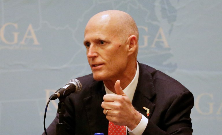 Florida Gov. Rick Scott during a news conference hours earlier told reporters that running for Senate this cycle is 