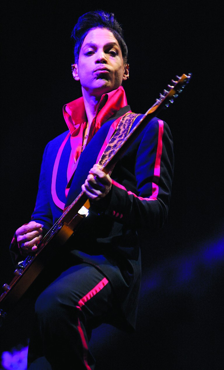 FILE - In this Nov. 14, 2010 file photo, Musician Prince performs in Yas Island, on the final night of the F1 motor race meeting in Abu Dhabi, United Arab Emirates. Prince will perform and be honored with Icon Award at the 2013 Billboard Music Awards. ABC announced on Friday, Jan. 18, 2013, that the 2013 Billboard Music Awards are set to return to ABC and will be broadcast live from the MGM Grand Garden Arena in Las Vegas Sunday, May 19, 2013 (8:00-11:00 p.m. ET). (AP Photo/Nousha Salimi, File)