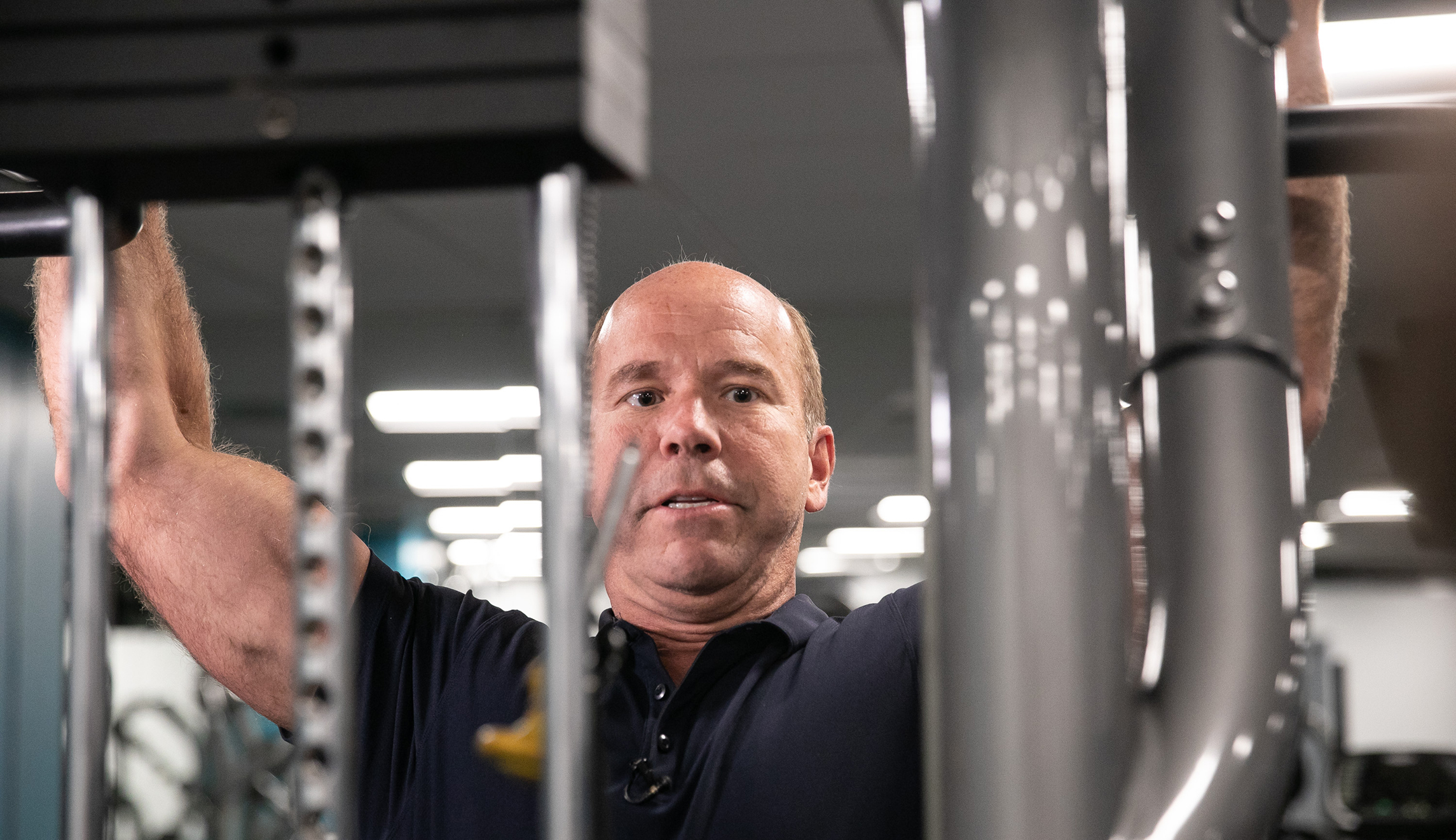 Presidential candidate John Delaney does pullups at his campaign headquarters' gym in Maryland.