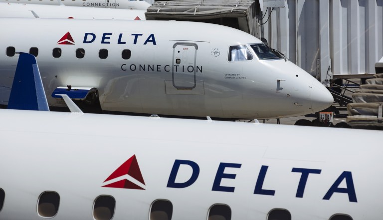 Delta Air Lines Inc. Connection planes sit at gates at Salt Lake City International airport (SLC) in Salt Lake City, Utah, U.S., on Thursday, July 5, 2018. Delta Air Lines Inc. is scheduled to release earnings figures on July 12.