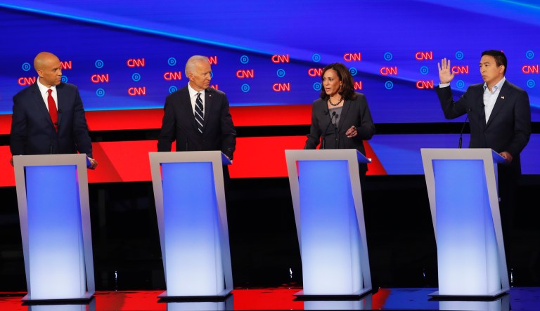 Sen. Cory Booker, D-N.J., from left, former Vice President Joe Biden, Sen. Kamala Harris, D-Calif., Andrew Yang and Rep. Tulsi Gabbard, D-Hawaii, participate in the second of two Democratic presidential primary debates hosted by CNN, July 31, 2019, in the Fox Theatre in Detroit. 