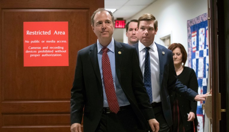 From left, Rep. Adam Schiff, D-Calif., ranking member of the House Permanent Select Committee on Intelligence, Rep. Jim Himes, D-Conn., rear, and Rep. Eric Swalwell, D-Calif., take a break from interviewing former White House chief strategist Steve Bannon as part of its ongoing Russia investigation, in Washington, Tuesday, Jan. 16, 2018.