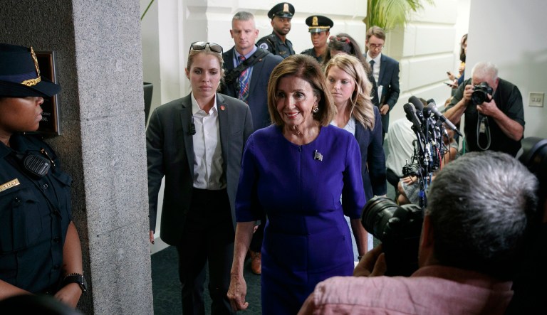 House Speaker Nancy Pelosi of Calif., center, walks past the media after attending a closed door caucus meeting about impeachment, Tuesday Sept. 24, 2019, on Capitol Hill in Washington.
