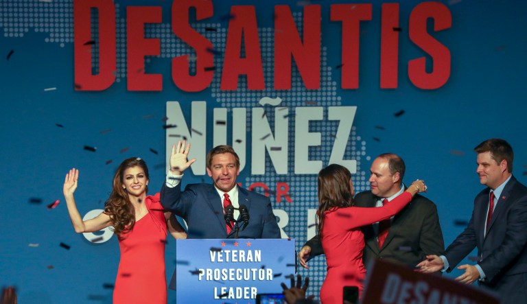 Republican Florida Governor-elect Ron DeSantis, center, waves to the supporters with his wife, Casey, left, and Republican Lt. Governor-elect Jeanette Nunez, third right, after thanking the crowd Tuesday, Nov. 6, 2018, in Orlando, Fla. DeSantis defeated Democratic candidate Andrew Gillum.