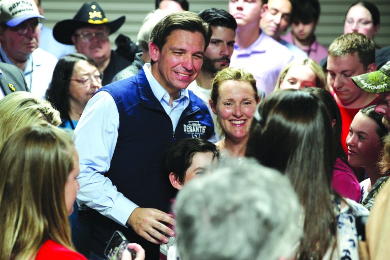 Florida Gov. Ron DeSantis poses for a picture with voters after giving a speech at a rally in Council Bluffs, Iowa, Wednesday. Several hundred people filled half of an event center to listen to DeSantis speak in his first trip to Iowa since announcing his presidential campaign. 