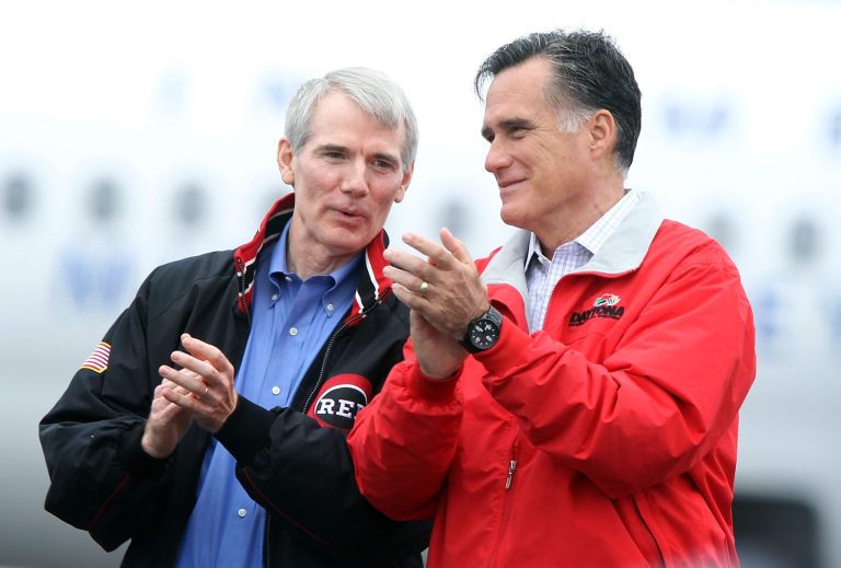 U.S. Sen. Rob Portman (R-OH) (L) campaigns for Republican presidential candidate Mitt Romney (R) during a Sept. 25 rally September 25, 2012 at Dayton International Airport. (Getty Images)