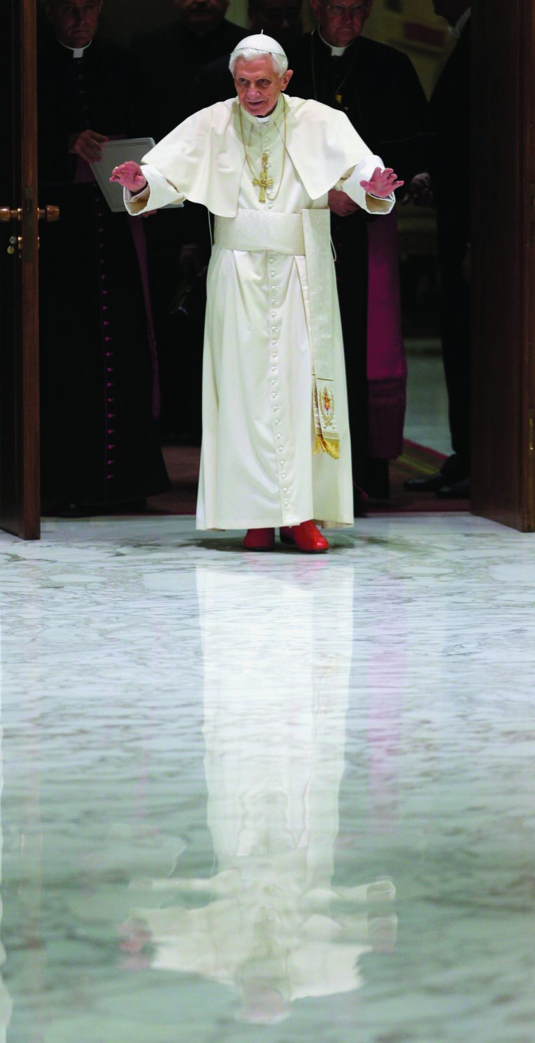 Pope Benedict XVI waves upon his arrival for a meeting with the 