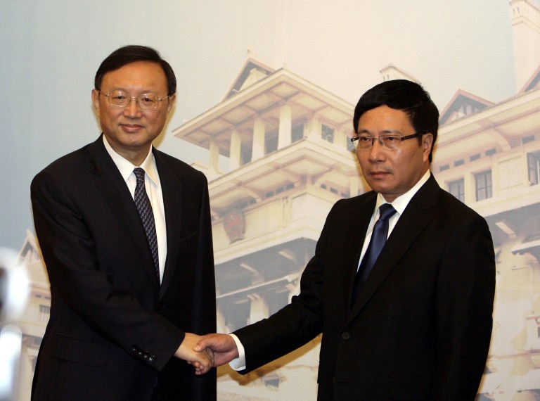 Chinese State Councilor Yang Jiechi, left, shakes hands with Vietnamese Deputy Prime Minister and Foreign Minister Pham Binh Minh before their talks behind closed-door on the tension in the South China Sea in Hanoi, Vietnam on Wednesday June 18, 2014. Yang's visit is the highest-level direct dialogue bewteen the two countries since tension flared following Chinese placement of an oil rig off Vietnam's coast in early May. (AP Photo/Tran Van Minh.)