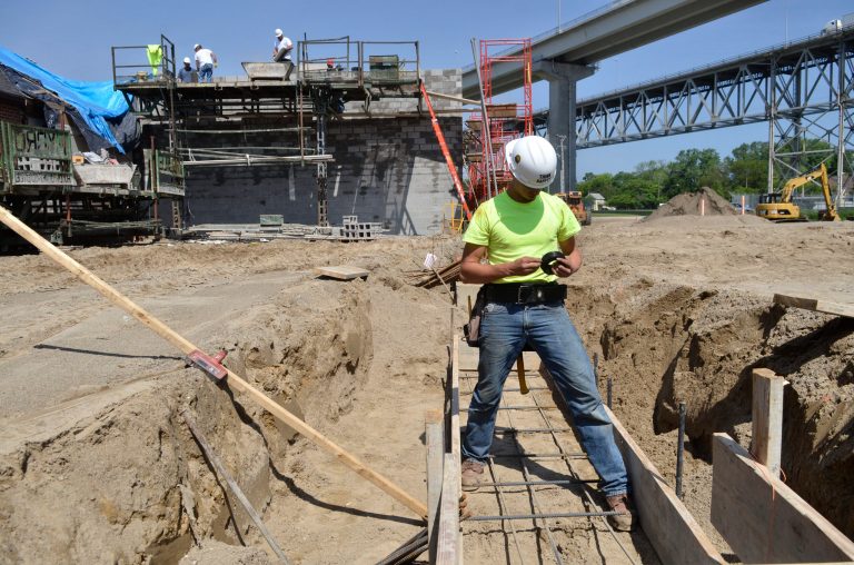 Nate Dohr, of Bancroft, places the rebar into mold where the concrete will be poured for a wall at the convention center Thursday, June 19, 2014, in Port Huron, Mich. The site is next to the DoubleTree by Hilton in Port Huron. (AP Photo/Times Herald, Mark R. Rummel)