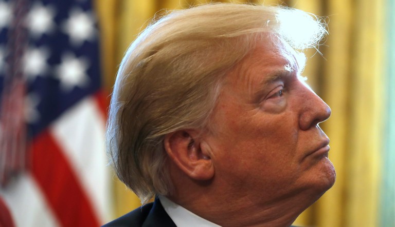 President Donald Trump listens during a meeting with American manufacturers in the Oval Office of the White House, Thursday, Jan. 31, 2019, in Washington. Trump was signing an executive order pushing those who receive federal funds to "buy American."