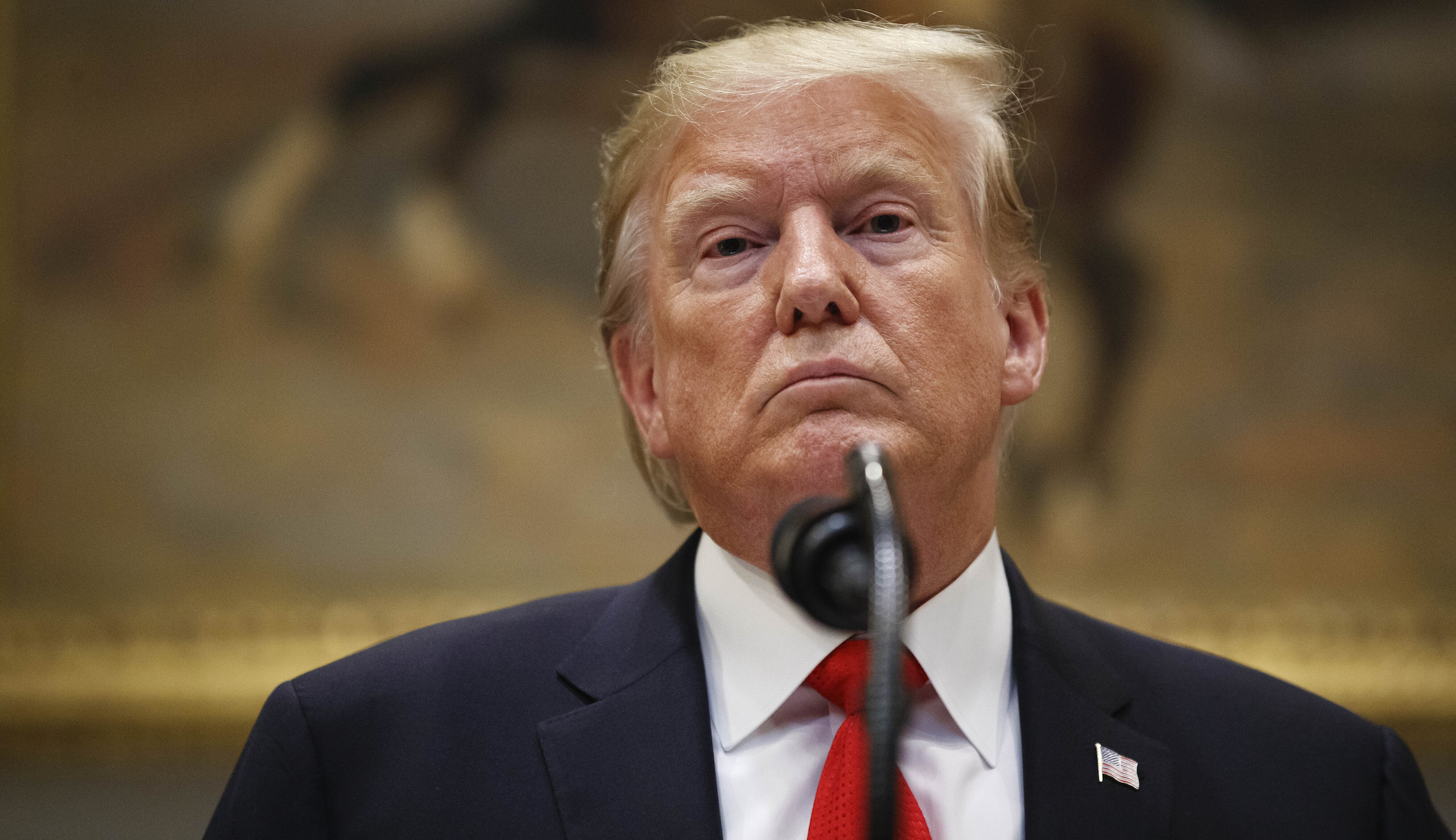 Former Trump campaign staffer who accused Trump of forcibly kissing her drops lawsuit