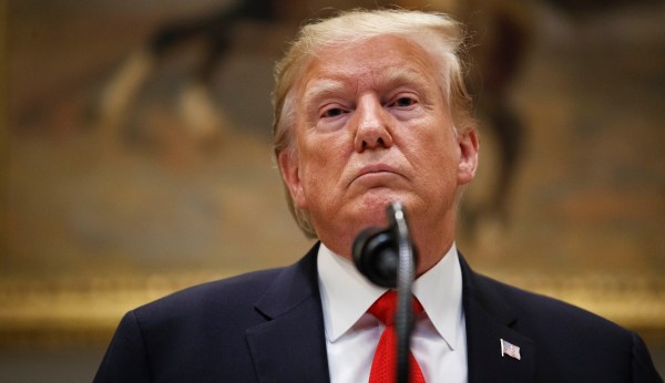 Former Trump campaign staffer who accused Trump of forcibly kissing her drops lawsuit
