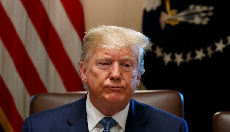President Donald Trump pauses while speaking as reporters leave the room during a Cabinet meeting in the Cabinet Room of the White House, Tuesday, July 16, 2019, in Washington.