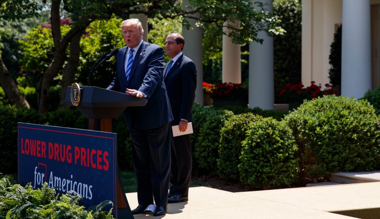 Secretary of Health and Human Services Alex Azar looks on as President Donald Trump speaks during an event about prescription drug prices in the Rose Garden of the White House, Friday, May 11, 2018, in Washington.