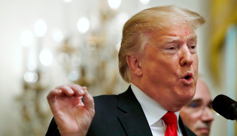 President Donald Trump gestures while speaking about taxes, Friday, June 29, 2018, during an event in the East Room of the White House in Washington.