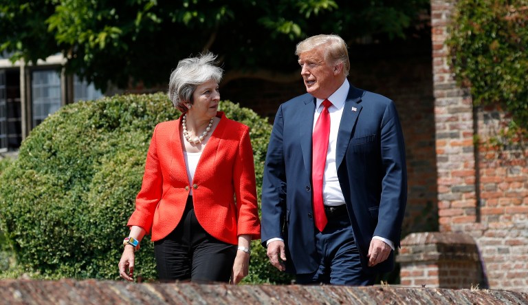 President Donald Trump and British Prime Minister Theresa May walk out together to begin their joint news conference at Chequers, in Buckinghamshire, England, Friday, July 13, 2018.